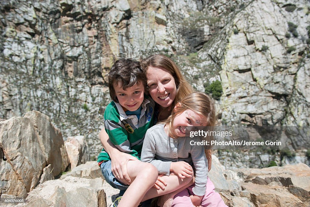 Mom With Rocks Mother And Children Sitting On Rock Formation Portrait High-Res Stock ...
