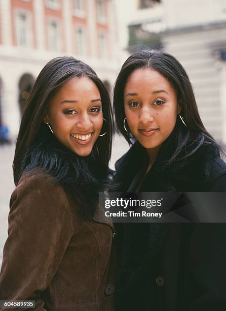 Identical twin sisters Tia and Tamera Mowry of American sitcom 'Sister Sister', circa 1995.