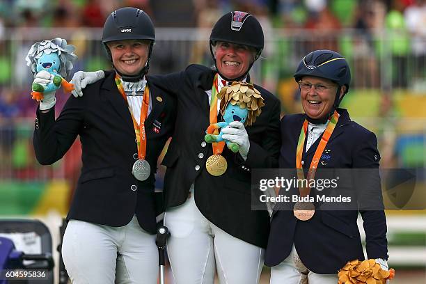 Silver medalist Susanne Sunesen, gold medalist Ann Cathrin Lubbe of Norway, bronze medalist Louise Etzner Jakobsson of Sweden celebrate on the podium...