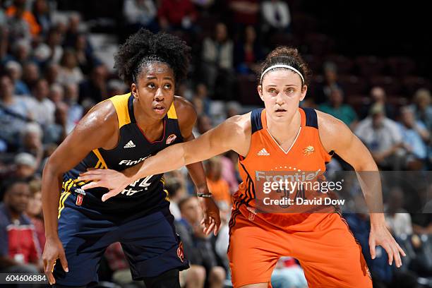 Kelly Faris of the Connecticut Sun boxes out against Shenise Johnson of the Indiana Fever on September 13, 2016 at the Mohegan Sun Arena in...