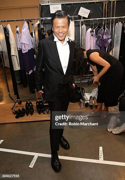 Designer Zang Toi poses backstage at his September 2016 during New York Fashion Week at Pier 59 Studios on September 13, 2016 in New York City.