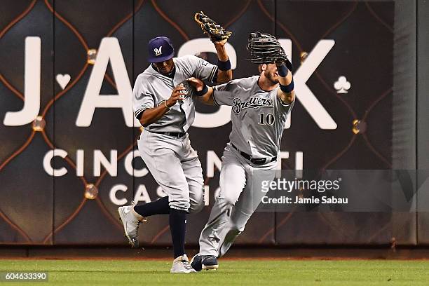Keon Broxton and Kirk Nieuwenhuis of the Milwaukee Brewers collide after Nieuwenhuis caught a fly ball in the third inning against the Cincinnati...