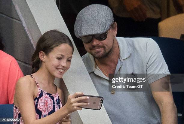 Leonardo DiCaprio seen taking selfie with a teenager girl at USTA Billie Jean King National Tennis Center on September 11, 2016 in the Queens borough...