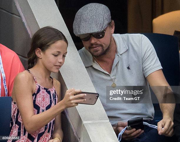 Leonardo DiCaprio seen taking selfie with a teenager girl at USTA Billie Jean King National Tennis Center on September 11, 2016 in the Queens borough...