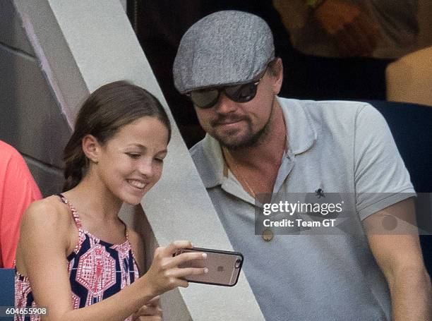 Leonardo DiCaprio seen taking selfie with a teenager girl at USTA Billie Jean King National Tennis Center on September 11, 2016 in the Queens borough...