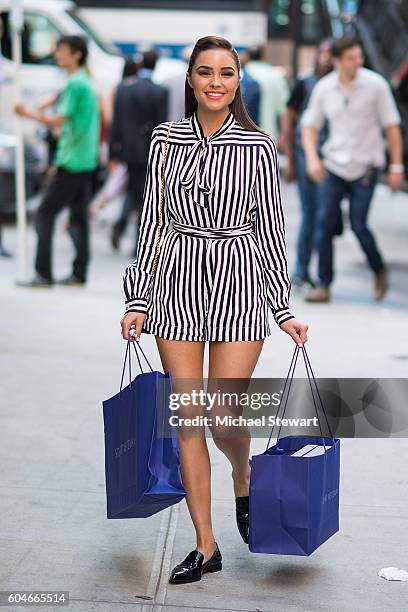 Model Olivia Culpo seen wearing a Philosophy dress, Stuart Weitzman shoes and a Sophie Hulme clutch in Midtown on September 13, 2016 in New York City.