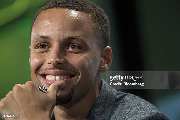 Stephen Curry, a professional basketball player with the National Basketball Association's Golden State Warriors, smiles during the TechCrunch...