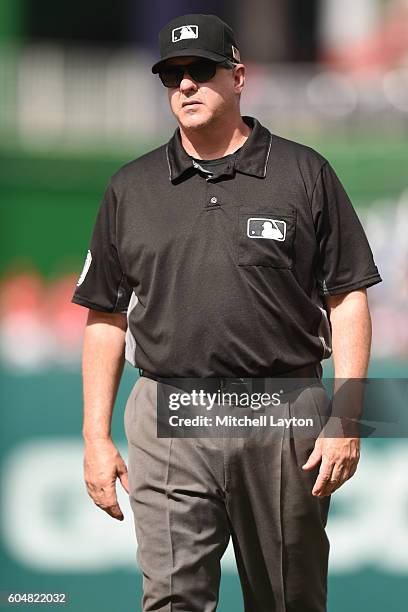 Umpire Paul Emmel looks on during a baseball game against the Philadelphia Phillies at Nationals Park on September 11, 2016 in Washington, DC. The...