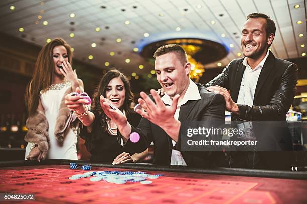 kisses by the luck at poker - playing to win stockfoto's en -beelden