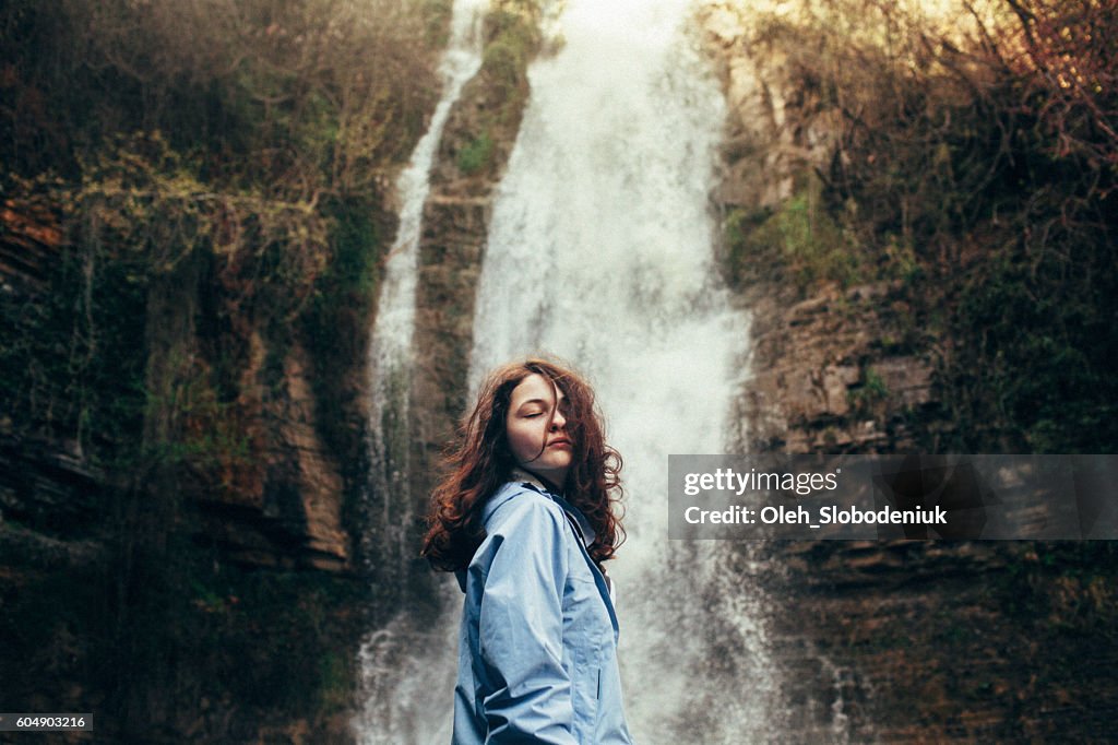 Girl near the waterfall