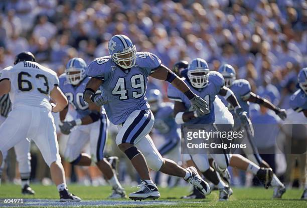 Defensive End Julius Peppers of the North Carolina Tar Heels running after the ball during the game against the Wake Forest Demon Deacons at the...