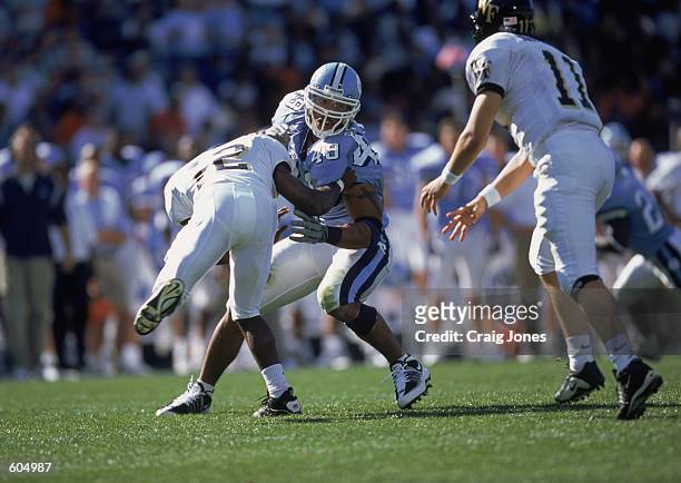 Defensive End Julius Peppers of the North Carolina Tar Heels blocking a player during the game against the Wake Forest Demon Deacons at the Kenan...