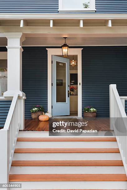 traditional home with blue painted siding - front door open stock pictures, royalty-free photos & images