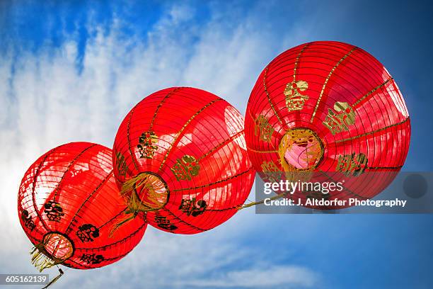 chinese lanterns against blue sky - chinese lantern festival stock pictures, royalty-free photos & images