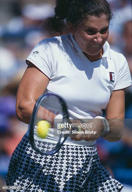 Monica Seles of the United States makes a double back hand return against Conchita Martínez during their Women's Singles Semi Final match of the US...