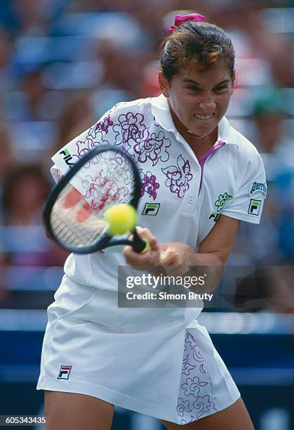 Monica Seles of Yugoslavia makes a double back hand return against Arantxa Sanchez Vicario during the Women's Singles final of the US Open Tennis...