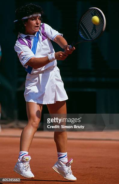 Arantxa Sanchez Vicario of Spain makes a double hand return during the Women's Singles Second Round match against Mercedes Paz at the French Open...