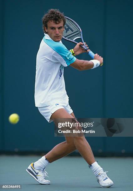 Mats Wilander of Sweden makes a double hand return during a Men's Singles match at the ATPLipton International Players Championship on 15 March 1988...