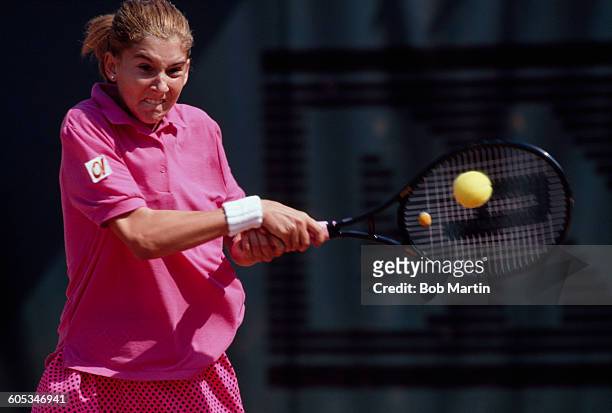 Monica Seles of Yugoslavia makes a double back hand return during the Women's Singles Semi Final match against Steffi Graf at the French Open Tennis...