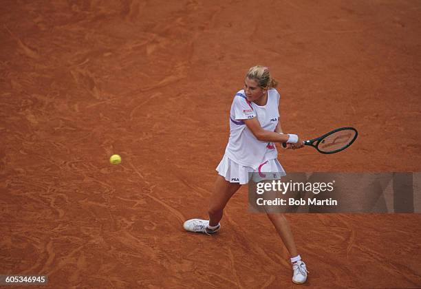 Monica Seles of Yugoslavia makes a double back hand return during the Women's Singles Final match against Steffi Graf at the French Open Tennis...