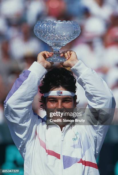 Arantxa Sanchez Vicario of Spain lifts the crystal glass trophy after winning the Women's Doubles Final match with Larisa Savchenko Neiland at the...