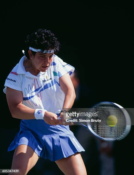 Arantxa Sanchez Vicario of Spain makes a double hand return during a Women's Singles first round match at the ATP Lipton International Players...