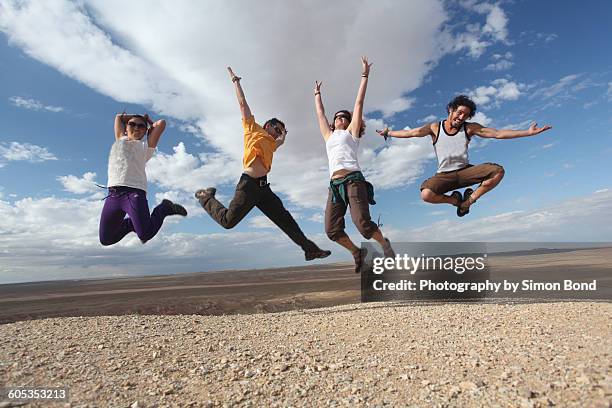 jump for joy! - wüste gobi stock-fotos und bilder