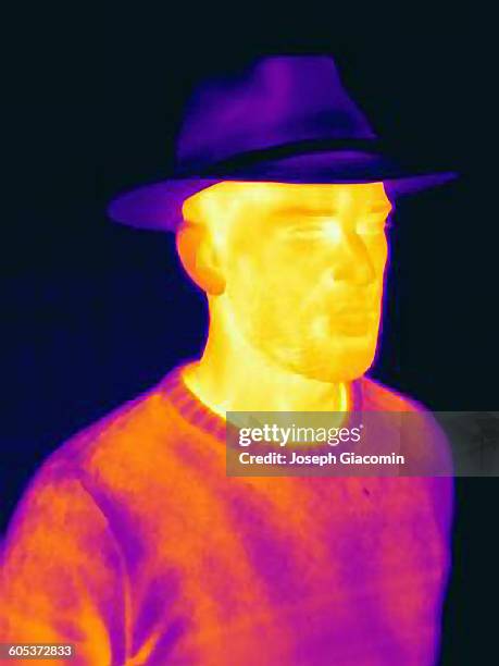 thermal image of man wearing face mask panama hat - 熱映像 ストックフォトと画像