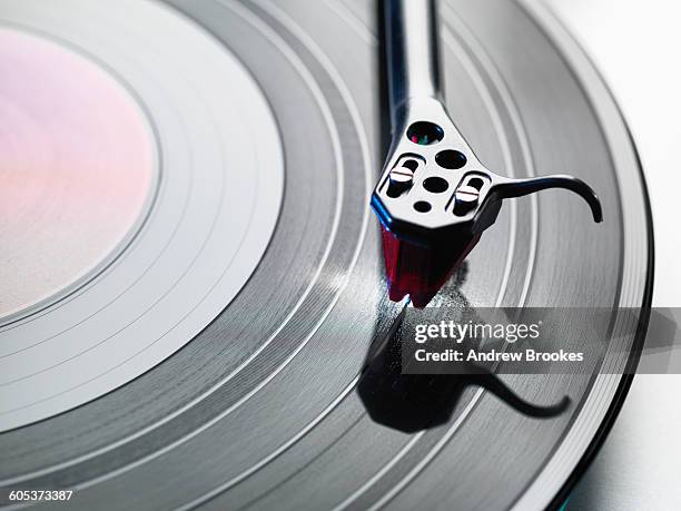 overhead close up of turntable stylus playing a vinyl record - vintage record player no people ストックフォトと画像