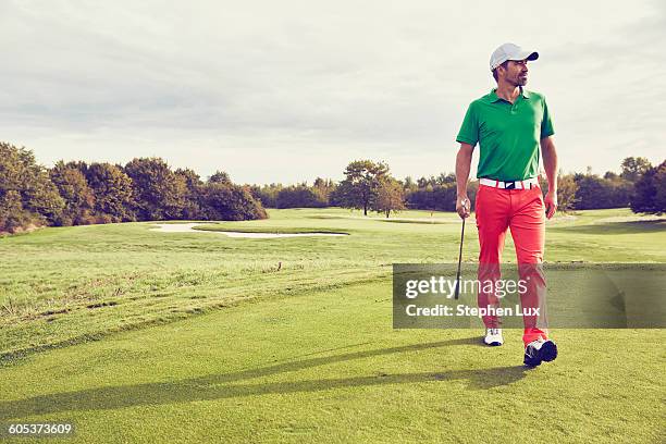 golfer walking on course, korschenbroich, dusseldorf, germany - calças verdes imagens e fotografias de stock