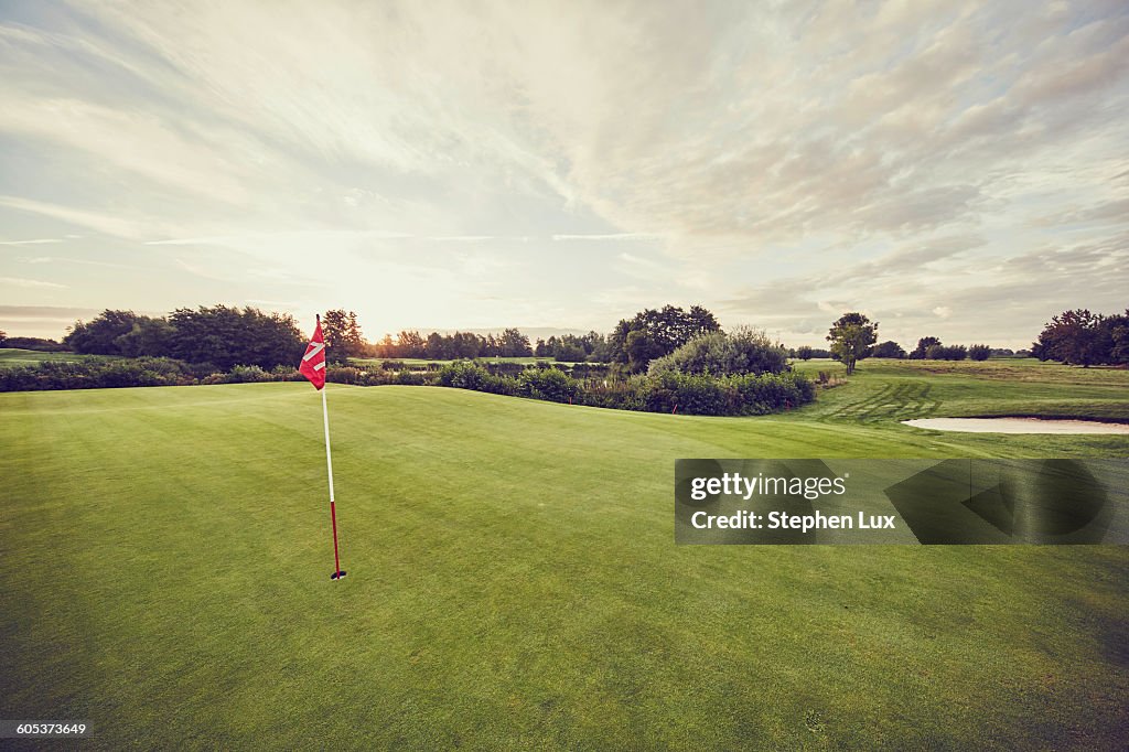 Flag in hole on golf course, Korschenbroich, Dusseldorf, Germany