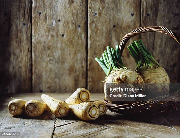 parsnips and celeriac is wicker basket - apio nabo fotografías e imágenes de stock