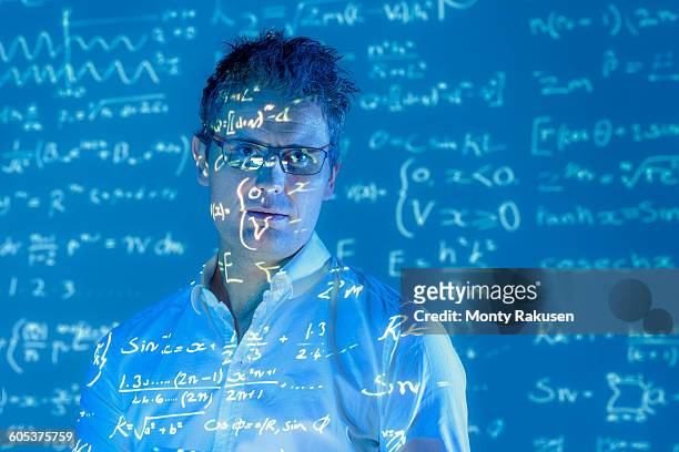 portrait of scientist with projected mathematical data - mathematician stock pictures, royalty-free photos & images