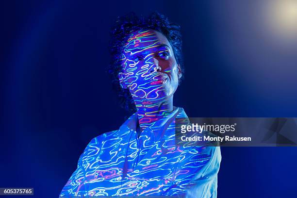 portrait of female scientist with graphical geological data projection - monty rakusen portrait stock pictures, royalty-free photos & images