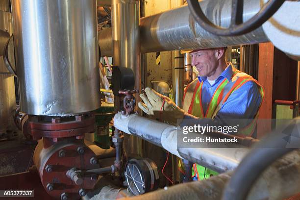 engineer in electric power plant testing a transducer electrical signal - transducer stock pictures, royalty-free photos & images