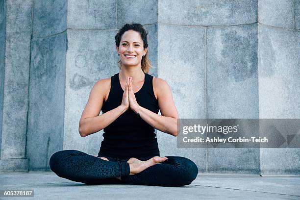woman in anjali mudra pose - tank top stock pictures, royalty-free photos & images