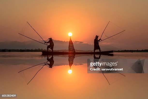 fisherman fishing in mekong river, thailand - river mekong stock pictures, royalty-free photos & images