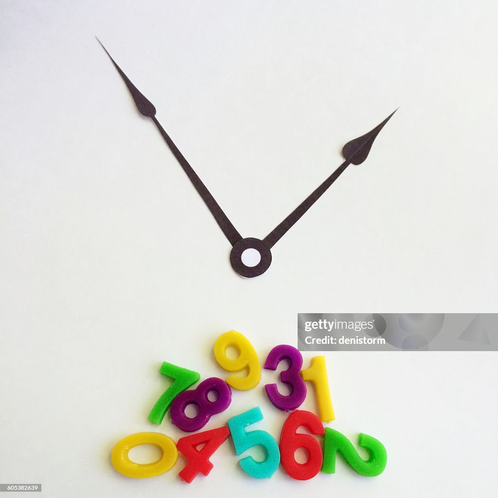 Clock hands with fallen numbers