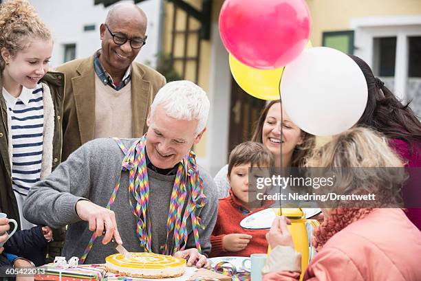 family celebrating grandfathers birthday, bavaria, germany - 50 60 jahre brille stock-fotos und bilder