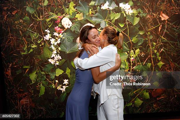 Artist Anne de Carbuccia greets guest at ONE: One Planet One Future at Bank Street Theater on September 13, 2016 in New York City.