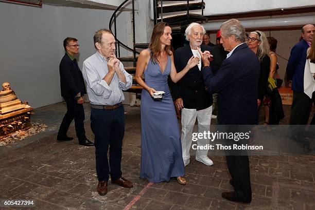 Artist Anne de Carbuccia greets guests at ONE: One Planet One Future at Bank Street Theater on September 13, 2016 in New York City.