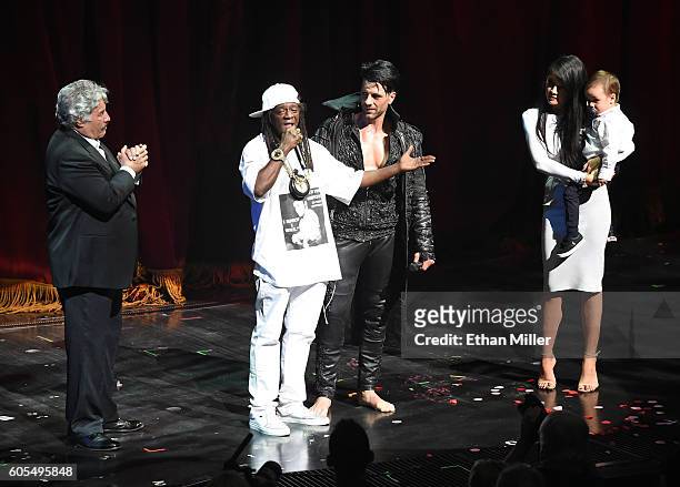 Singer Tony Orlando, rapper Flavor Flav illusionist Criss Angel, Shaunyl Benson and Angel and Benson's son Johnny Crisstopher Sarantakos appear...