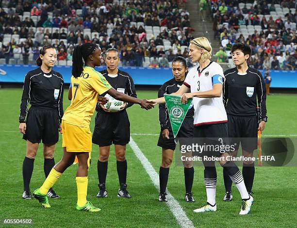 Rudo Neshamba of Zimbabwe and Saskia Bartusiak of Germany shake hands prior to the Women's First Round Group F match between Zimbabwe and Germany at...