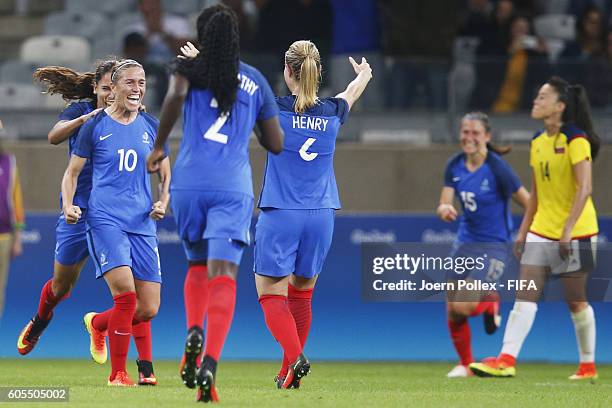 Camille Abily of France celebrates with her team mates after scoring her team's third goal during Women's Group G match between France and Colombia...