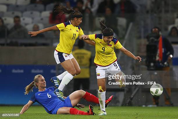 Amandine Henry of France and Catalina Usme and Orianica Velasquez of Columbia compete for the ball during Women's Group G match between France and...