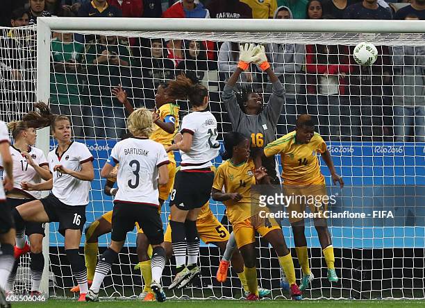 Sara Daebritz of Germany heads the ball past Lindiwe Magwede of Zimbabwe to score during the Women's First Round Group F match between Zimbabwe and...