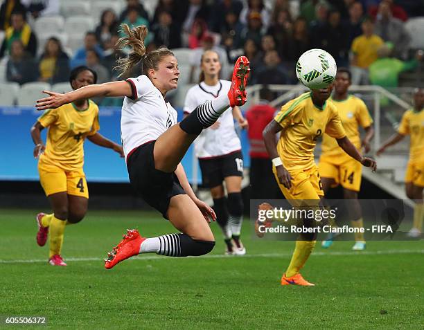 Melanie Leupolz of Germany leaps for the ball during the Women's First Round Group F match between Zimbabwe and Germany at Arena Corinthians on...