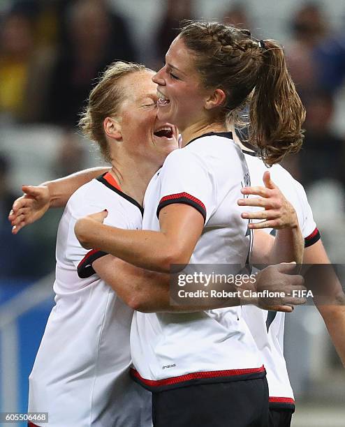 Melanie Leupolz of Germany celebrates with team mates after scoring a goal during the Women's First Round Group F match between Zimbabwe and Germany...