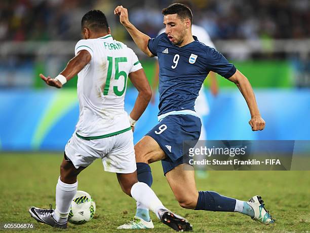 Jonathan Calleri of Argentina is challenged by Rachid Ait- Atmane of Algeria during the Olympic Men's Football match between Argentina and Algeria at...