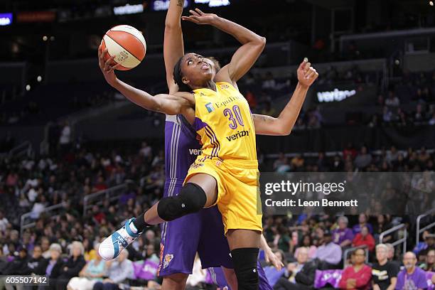 Nneka Ogwumike of the Los Angeles Sparks handles the ball against Brittney Griner of the Mercury Phoenix during a WNBA basketball game at Staples...